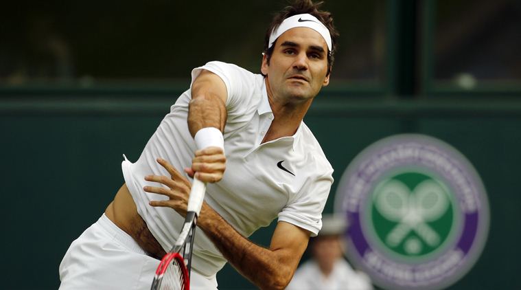 Roger Federer of Switzerland serves to Guido Pella of Argentina during their men's singles match on day one of the Wimbledon Tennis Championships in London, Monday, June 27, 2016. (AP Photo/Alastair Grant)